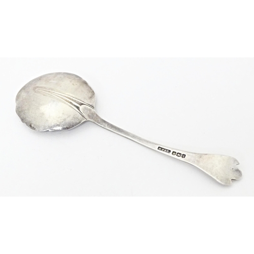 250 - A silver jam / preserve spoon with trefid hand and rats tail bowl, hallmarked Sheffield 1933, maker ... 