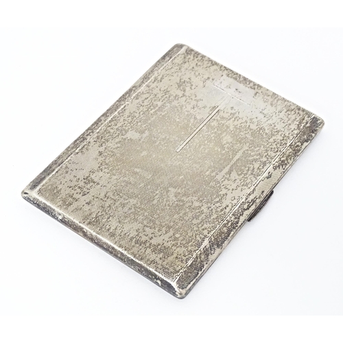 254 - An Art Deco silver cigarette case with engine turned decoration and gilded interior, hallmarked Birm... 