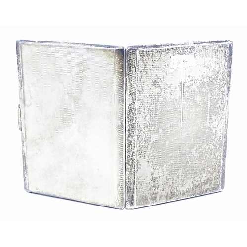 254 - An Art Deco silver cigarette case with engine turned decoration and gilded interior, hallmarked Birm... 