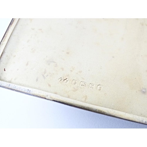 254 - An Art Deco silver cigarette case with engine turned decoration and gilded interior, hallmarked Birm... 