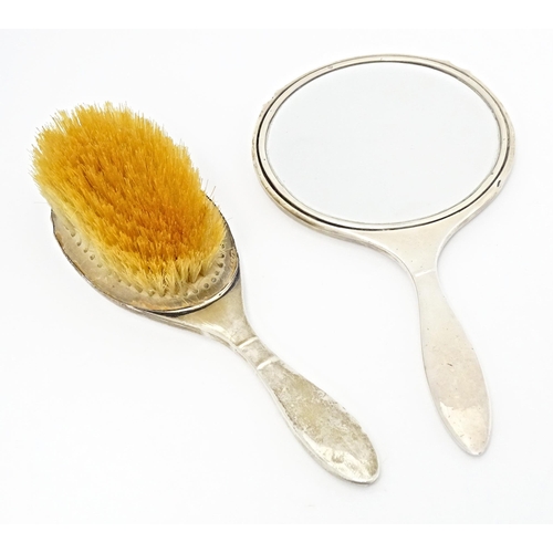 282 - An Art Deco silver backed brush and hand mirror with engine turned decoration, hallmarked Birmingham... 