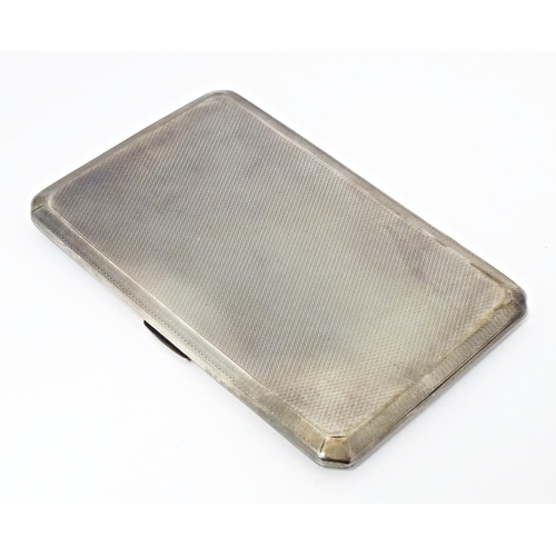 283 - An Art Deco silver cigarette case with engine turned decoration, hallmarked Birmingham 1937, maker A... 