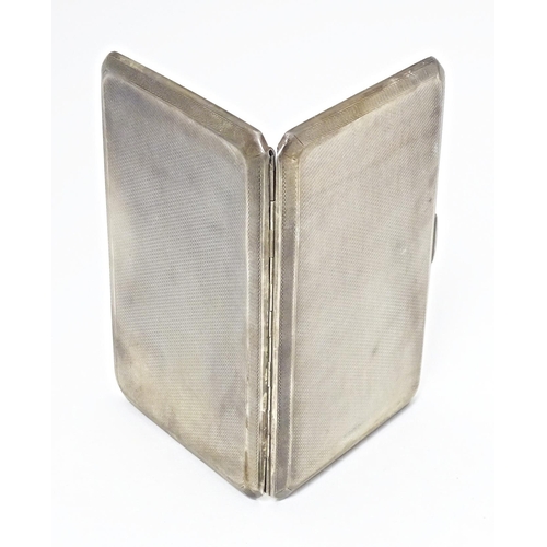 283 - An Art Deco silver cigarette case with engine turned decoration, hallmarked Birmingham 1937, maker A... 