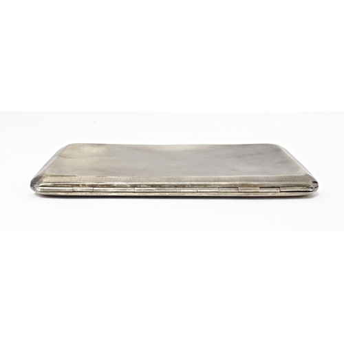 283 - An Art Deco silver cigarette case with engine turned decoration, hallmarked Birmingham 1937, maker A... 