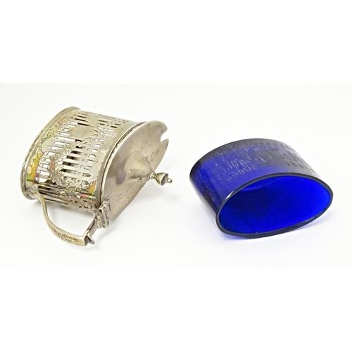 285 - A silver mustard pot with hinged lid, pierced detail and blue glass liner, hallmarked London1899, ma... 