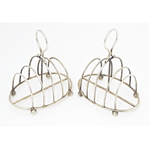 287 - A pair of Victorian silver five bar toast racks of oval form hallmarked Sheffield 1894, maker Martin... 