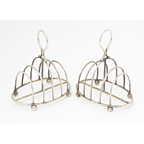 287 - A pair of Victorian silver five bar toast racks of oval form hallmarked Sheffield 1894, maker Martin... 