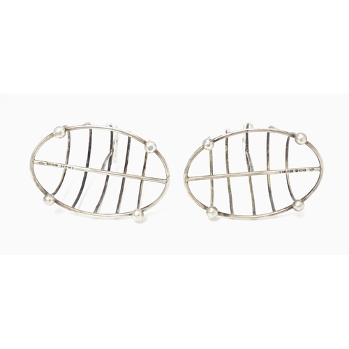 287 - A pair of Victorian silver five bar toast racks of oval form hallmarked Sheffield 1894, maker Martin... 