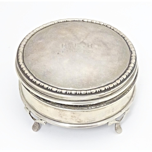 290 - A silver ring box of circular firm with out swept feet, hallmarked London 1917, maker Charles Edward... 