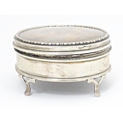 290 - A silver ring box of circular firm with out swept feet, hallmarked London 1917, maker Charles Edward... 