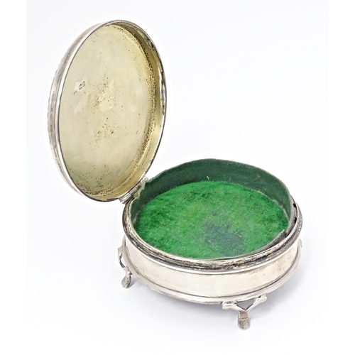 290 - A silver ring box of circular firm with out swept feet, hallmarked London 1917, maker Charles Edward... 