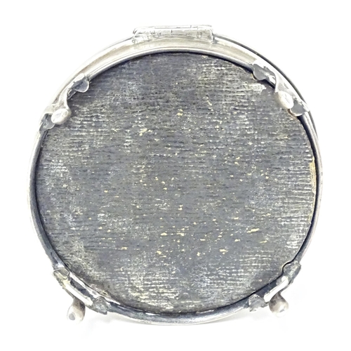 290 - A silver ring box of circular firm with out swept feet, hallmarked London 1917, maker Charles Edward... 