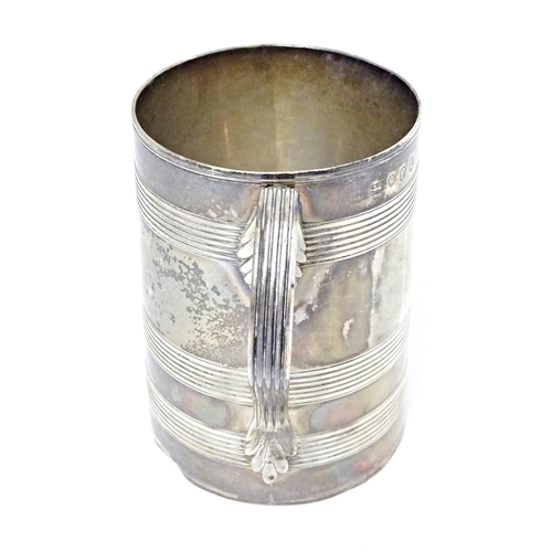 292 - A Geo III silver tankard with banded decoration and loop handle hallmarked London 1790, maker Henry ... 