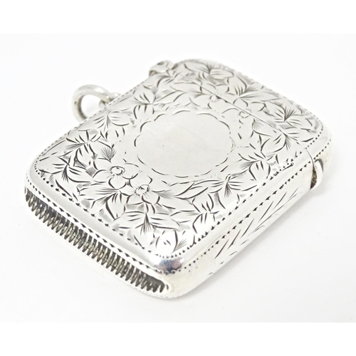 305 - A Victorian silver vesta case with engraved floral and foliate detail, hallmarked Birmingham 1898, m... 