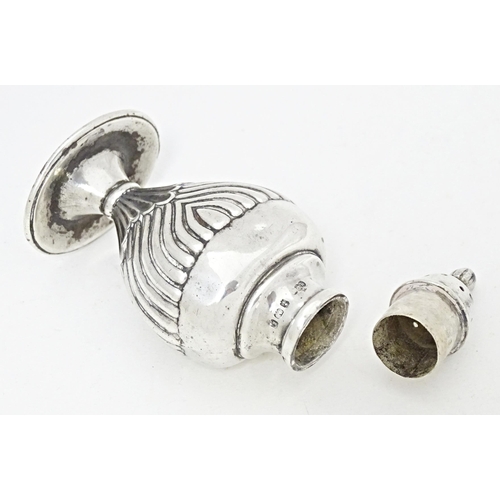 311 - A silver pepperette of shaped form hallmarked Birmingham 1906, maker Keight & Newman. Approx. 3 3/4