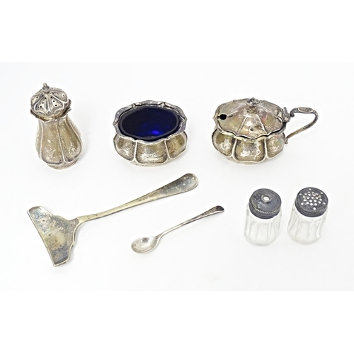 313 - A quantity of assorted items to include a silver three piece cruet set comprising salt, mustard and ... 