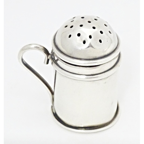 317 - A miniature silver pepperette modelled as a flour shaker, hallmarked Birmingham 1903. Approx. 1 3/4