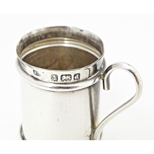 317 - A miniature silver pepperette modelled as a flour shaker, hallmarked Birmingham 1903. Approx. 1 3/4