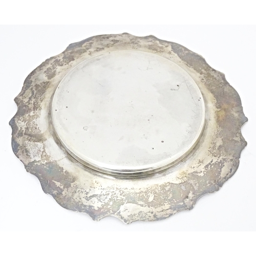 318 - A silver dish / coaster hallmarked London 1902, maker William Hutton & Sons. Ltd. Approx. 5 1/2