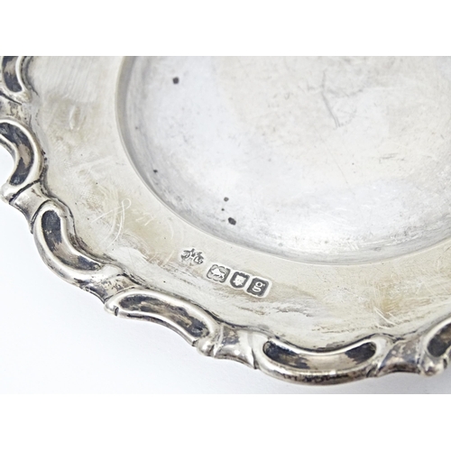 318 - A silver dish / coaster hallmarked London 1902, maker William Hutton & Sons. Ltd. Approx. 5 1/2