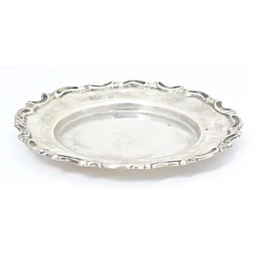 318 - A silver dish / coaster hallmarked London 1902, maker William Hutton & Sons. Ltd. Approx. 5 1/2