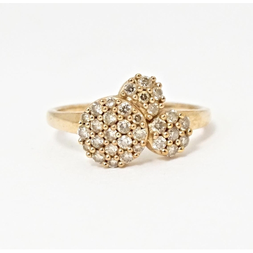 592 - A 9ct rose gold ring set with a profusion of Argyle diamonds. Ring size approx. N