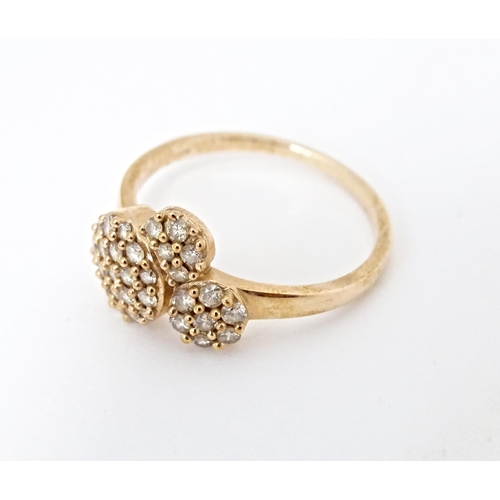 592 - A 9ct rose gold ring set with a profusion of Argyle diamonds. Ring size approx. N