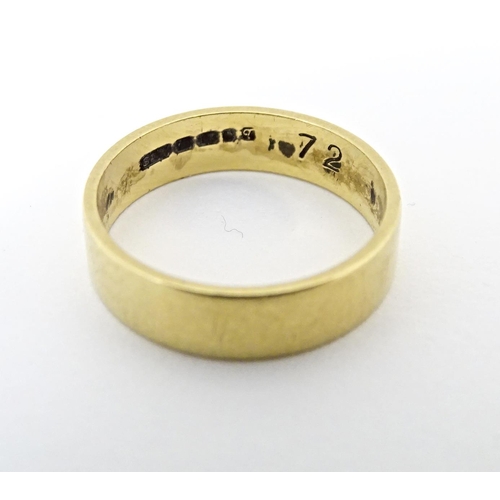 601 - An 18ct gold ring. Ring size approx. K 1/2