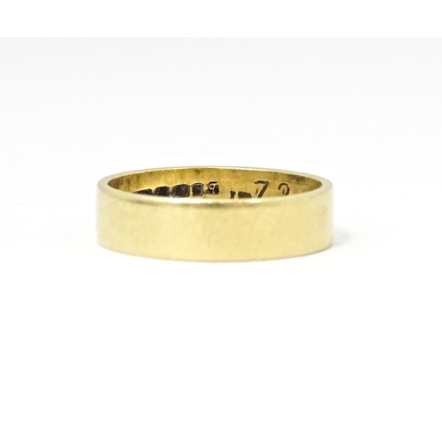 601 - An 18ct gold ring. Ring size approx. K 1/2