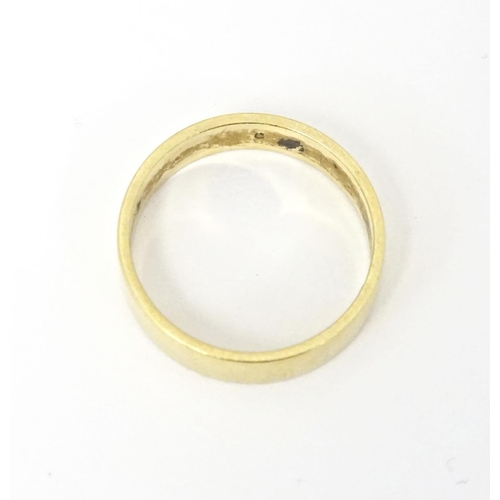 601 - An 18ct gold ring. Ring size approx. K 1/2