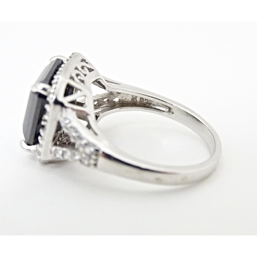 605 - A silver dress ring. Together with a silver gilt dress ring. Ring sizes approx. L (2)