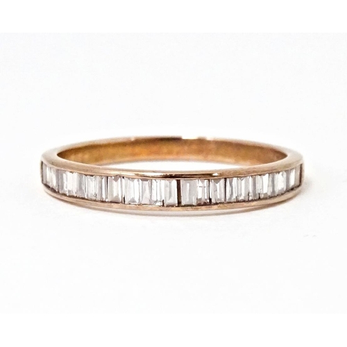 620 - A 9ct rose gold half eternity ring set with pink diamonds. Ring size approx. R