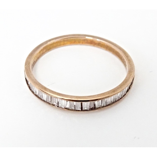 620 - A 9ct rose gold half eternity ring set with pink diamonds. Ring size approx. R