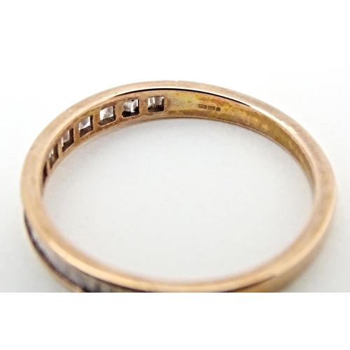 620 - A 9ct rose gold half eternity ring set with pink diamonds. Ring size approx. R