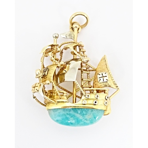 628 - An 18ct gold pendant / brooch formed as a three mast sailing ship set with green amazonite style sto... 