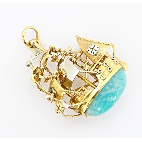 628 - An 18ct gold pendant / brooch formed as a three mast sailing ship set with green amazonite style sto... 