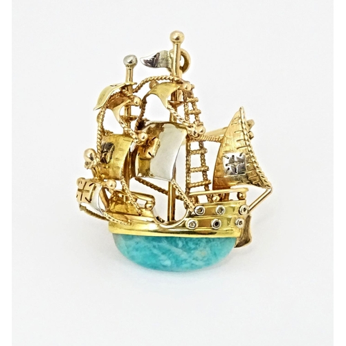 628 - An 18ct gold pendant / brooch formed as a three mast sailing ship set with green amazonite style sto... 