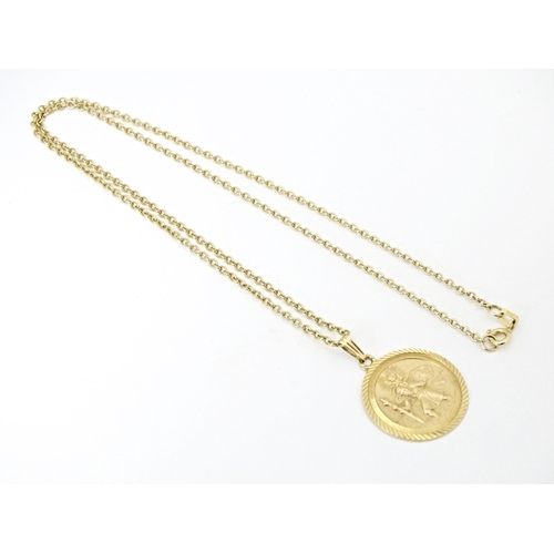 629 - A 9ct gold chain with St. Christopher. Chain approx. 18