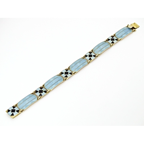 633 - Scandinavian jewellery: A Swedish silver gilt bracelet with pale blue and black guilloche enamel dec... 