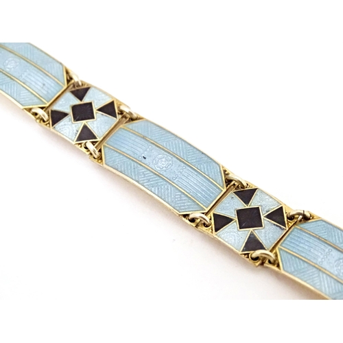 633 - Scandinavian jewellery: A Swedish silver gilt bracelet with pale blue and black guilloche enamel dec... 