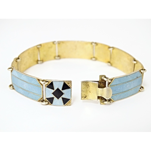 633 - Scandinavian jewellery: A Swedish silver gilt bracelet with pale blue and black guilloche enamel dec... 