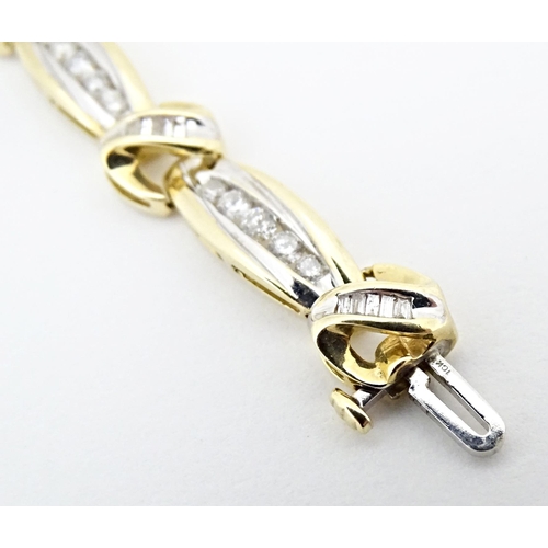 634 - A 9ct gold bracelet set with 50 diamonds interspersed by further bands of diamonds. Marked 10k. Appr... 