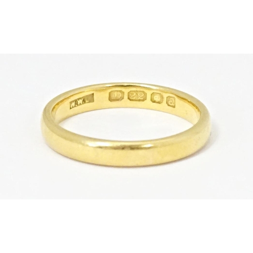 554 - A 22ct gold ring, hallmarked London 1956. Ring size approx. N