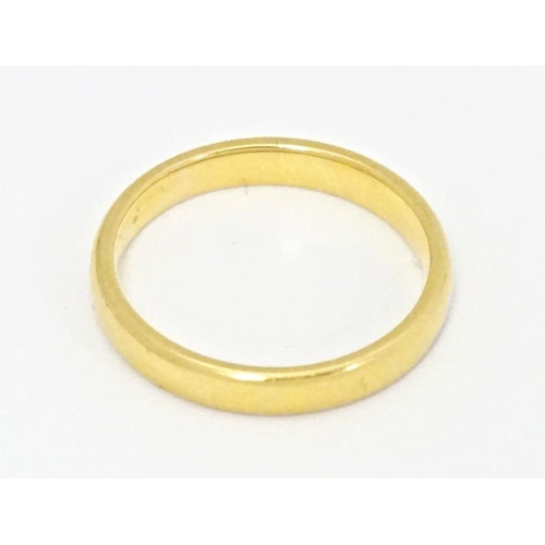 554 - A 22ct gold ring, hallmarked London 1956. Ring size approx. N