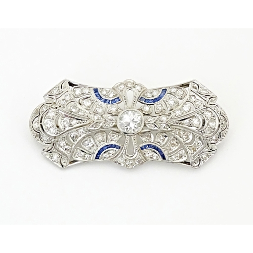 638 - An impressive diamond and sapphire Belle Epoque brooch set with a profusion of diamonds with sapphir... 