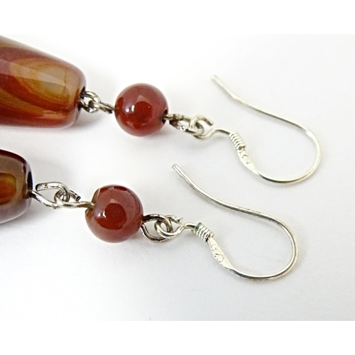 643 - A pair of agate drop earrings. Approx. 2