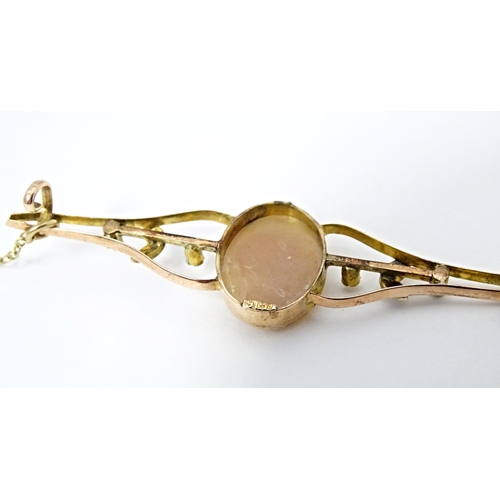 644 - A 9ct gold bar brooch set with central shell carved cameo and seed pearl detail. Together with a Vic... 