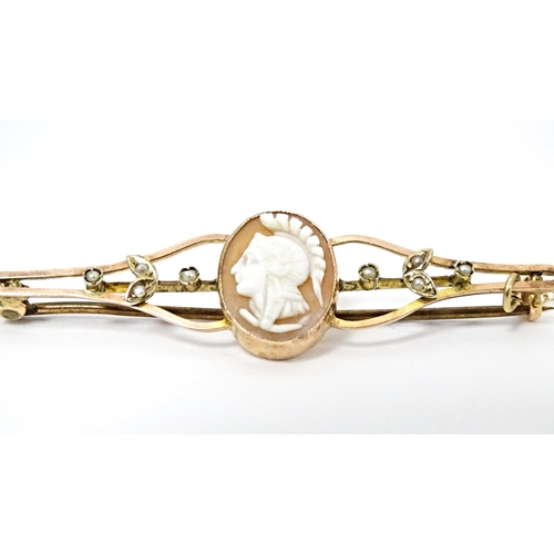 644 - A 9ct gold bar brooch set with central shell carved cameo and seed pearl detail. Together with a Vic... 