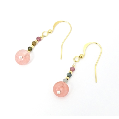 645 - A pair of drop earrings set with tourmaline. Approx. 1