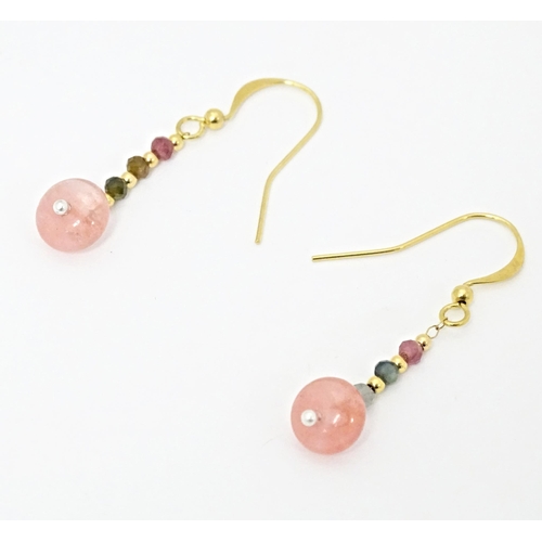 645 - A pair of drop earrings set with tourmaline. Approx. 1